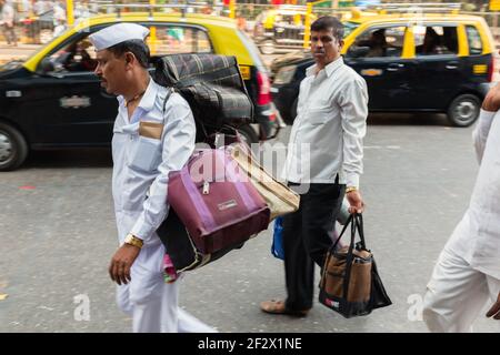 India, Mumbai - Mumbai Dabbawalas after delivering the food Stock Photo