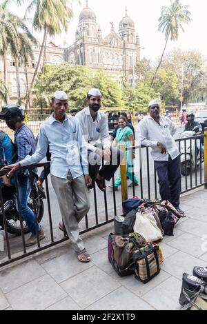 India, Mumbai - Mumbai Dabbawalas resting after delivering the food