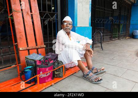 India, Mumbai - Mumbai Dabbawala after delivering the food Stock Photo
