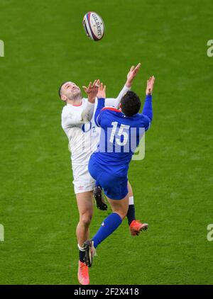 Twickenham Stadium, 13th Mar 2021  England's Jonny May competes for an aerial ball with Brice Dulin  Picture Credit : © Mark Pain / Alamy Live News Stock Photo