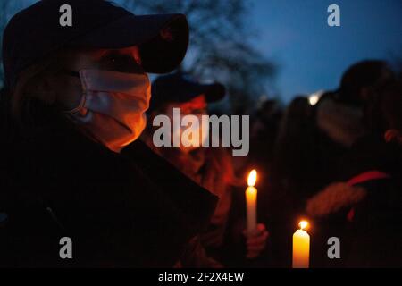 London, UK, 13 March 2021: Despite Metropolitan Police warnings hundreds of people gathered on Clapham Common at the bandstand as a vigil for  the murdered woman Sarah Everard and to protest more generally about police and society's attitudes to male violence and women's freedom. Anna Watson/Alamy Live News
