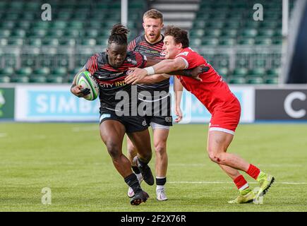 LONDON, UNITED KINGDOM. 13th, Mar 2021. Rotimi Segun of Saracens (left) is tackled during Greene King IPA Championship Rugby Match between Saracens vs Jersey Reds at Stonex Stadium on Saturday, 13 March 2021. LONDON ENGLAND.  Credit: Taka G Wu/Alamy Live News Stock Photo