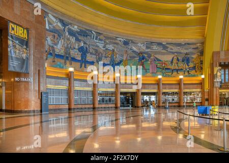 Cincinnati Union Terminal once served five railroads; the art deco landmark is now mostly museum space, with Amtrak departures only 3 nights weekly. Stock Photo