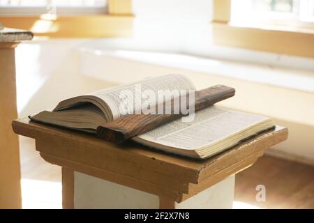 Book on a lectern in a small and old church Stock Photo