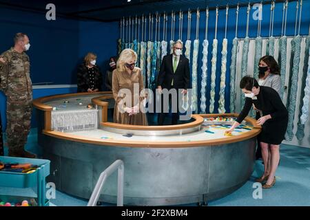 Tanya Durand, Executive Director of Greentrike, right, shows U.S First Lady Dr. Jill Biden and Washington State Governor Jay Inslee, center, around the Children's Museum at Joint Base Lewis-McChord March 9, 2021 near Tacoma, Washington. Stock Photo