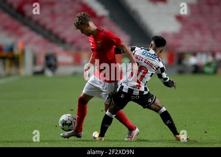 Lisbon, Portugal. 13th Mar, 2021. Luca Waldschmidt of SL Benfica (L) vies with Angel Gomes of Boavista FC during the Portuguese League football match between SL Benfica and Boavista FC at the Luz stadium in Lisbon, Portugal on March 13, 2021. Credit: Pedro Fiuza/ZUMA Wire/Alamy Live News Stock Photo