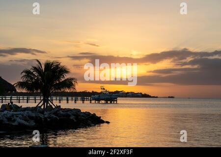 Florida Keys Sunset-Travel to the Gulf of Mexico along the Florida Coastline, enjoy the tranquility or this popular vacation beach destination Stock Photo