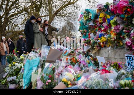 LONDON, ENGLAND - MARCH 13: Peoplelay flowers to pay their respects following the murder of Sarah Everard after an official vigil was cancelled due to the Covid-19 pandemic. Metropolitian Police Officer Wayne Couzens has been charged with her kidnap and murder. on Saturday 13th March 2021. (Credit: Lucy North | MI News) Credit: MI News & Sport /Alamy Live News
