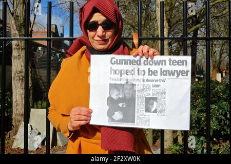 London (UK), March 13 2021: Hiva Boudiaf, mother of murder victim Karim Boudiaf holds up a newspaper article on the day preceding the 2021 Mothers Day