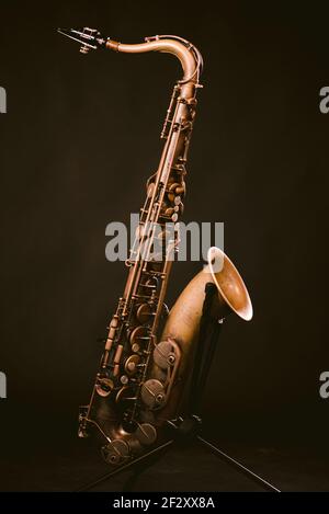 Wind Sax Instruments Contemporary classic brass wind instrument saxophone isolated on black ...