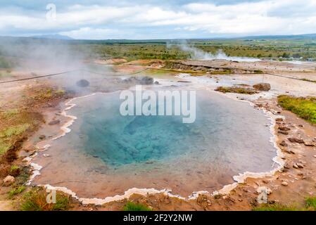 Strokkur geothermal area in Iceland Stock Photo