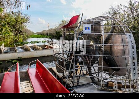 An Empty Airboat by Dock at Everglades National Park in Florida Stock Photo