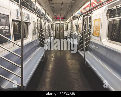 New York, NY - March 12 2021: Empty NY subway train. No people in wagon. NYC subway as one of the oldest public transportation system Stock Photo