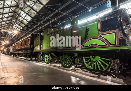 Green steam locomotive LSWR London and South Western Railway M7 class 0-4-4T Number 245 at National Railway Museum York England Stock Photo