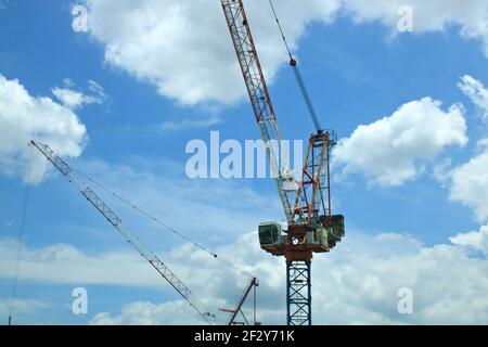 A slewing crane silhouette with cloudy sky Stock Photo - Alamy