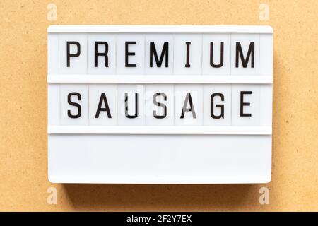 Lightbox with word premium sausage on wood background Stock Photo
