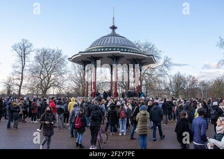 London, UK. 13th Mar, 2021. Londoners gathering during the vigil for Sarah Everard being held at Clapham Common. 33 year old Sarah Everard was walking to her home in Brixton when she was kidnaped and murdered. (Photo by Phil Lewis/SOPA Images/Sipa USA) Credit: Sipa USA/Alamy Live News Stock Photo
