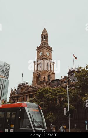 Light rail car the Town Hall building in Sydney's CBD. Stock Photo