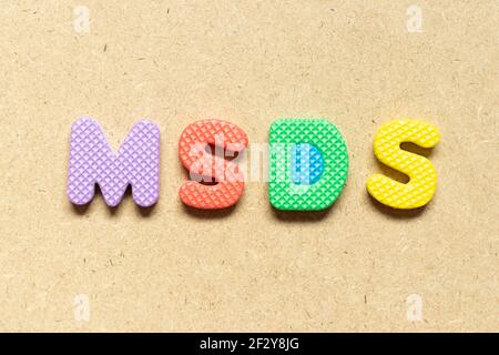 Foam alphabet letter in word MSDS (Abbreviation of material safety data sheet) on wood background Stock Photo