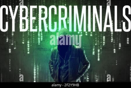 Faceless hacker with inscription Stock Photo