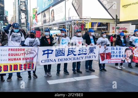 New York, NY - March 13, 2021: Members of China Democracy Party staged rally on Times Square Stock Photo