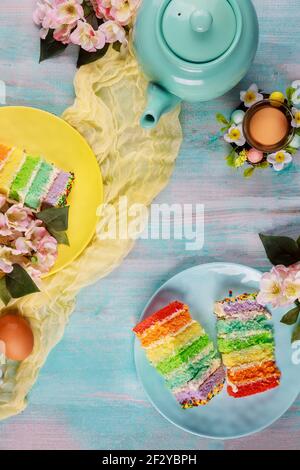 Beautiful Easter cakes with eggs and flowers. Top view. Stock Photo