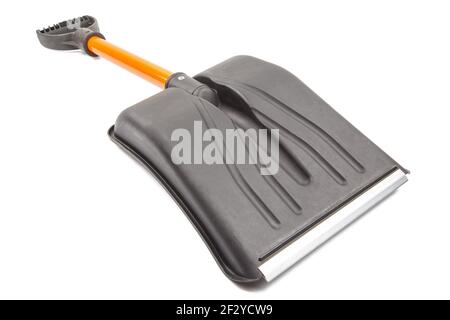 small plastic snow shovel, isolated on white background - back side, laid down, diagonal perspective blade toward camera Stock Photo