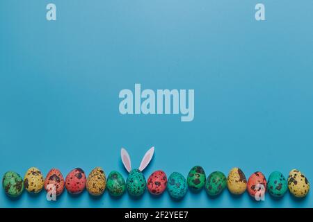 painted eggs on a blue background for easter Stock Photo