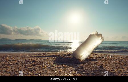 Pollution from plastic water bottles in the ocean. Environmental concept. Stock Photo