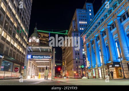 Night street view of The Waterfront Station subway escalator exit. Vancouver, Canada Stock Photo
