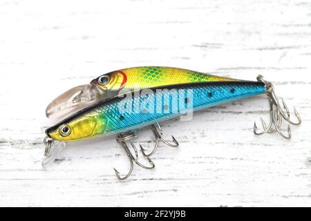 Plastic fishing lure on a white wooden table Stock Photo