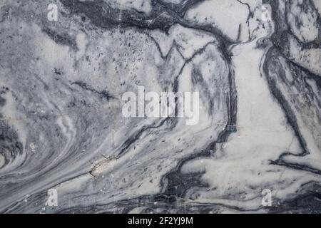 Natural marble texture background. Fragment of the wall of a marble quarry in Ruskeala, Karelia Stock Photo