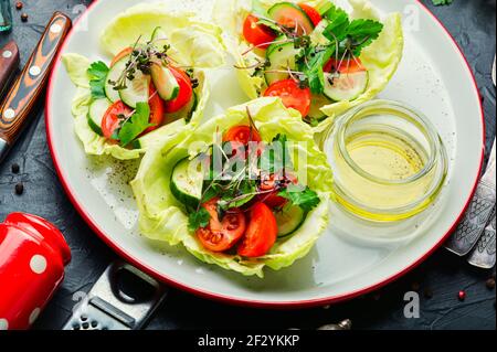 Vitamin summer salad with cabbage,cucumber,tomato and micro greens Stock Photo