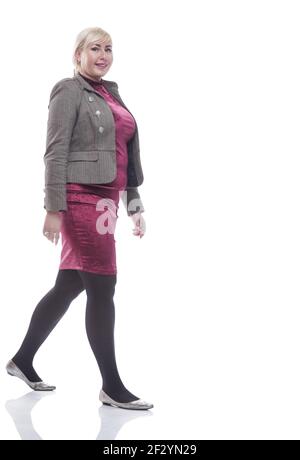 casual young woman stepping forward . isolated on a white Stock Photo ...