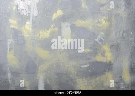 Abstract textured cloth gray background with blurred yellow spots. Stock Photo
