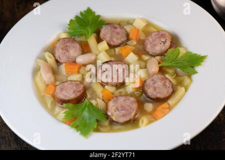 Root Vegetable, Smoked Sausage and White Bean Minestrone Recipe Stock Photo