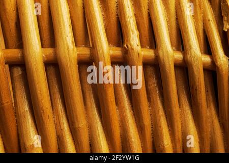 Dark orange twigs woven together close up Stock Photo