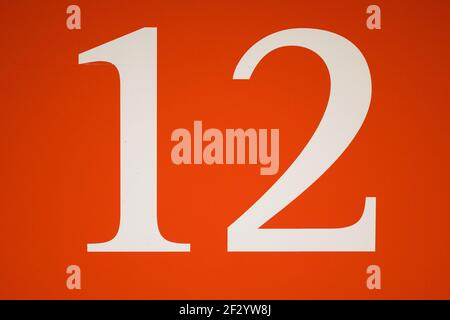 Sign with number twelve in red Stock Photo - Alamy