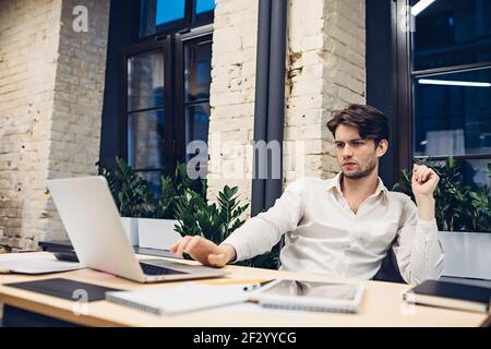 Concentrated businessman working on laptop Stock Photo