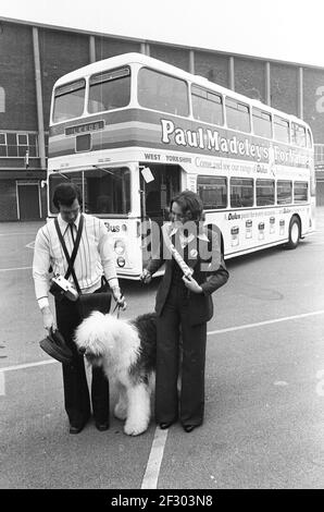 Paul Madeley of Leeds United launches his new colour centre with pals 1975 Stock Photo