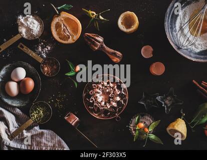 Cooking citrus and pistachio bundt cake on rusty table Stock Photo