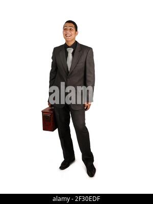 Man holding an old suitcase isolated over white background Stock Photo