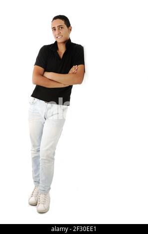 Arabic guy standing against the wall smiling, isolated Stock Photo