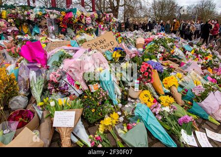 14th March 2021 - families pay their respects and lay floral tributes for Sarah Everard on Clapham Common, the day after the cancelled vigil