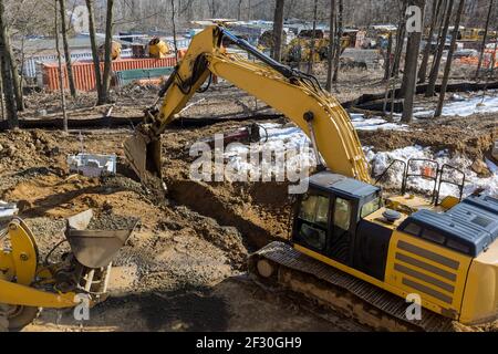 Excavator digging a trench for the pipeline. Excavation Stock Photo - Alamy
