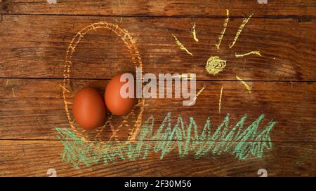 Easter eggs in a basket. Drawing with colored chalk on a wooden background Stock Photo