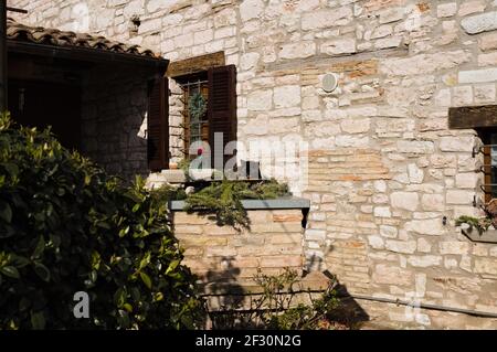 A black cat is sleeping on the balcony of a countryside italian house (Marche, Italy, Europe) Stock Photo
