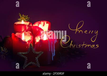 Four red burning Advent candles and decoration. . Christmas background. Stock Photo