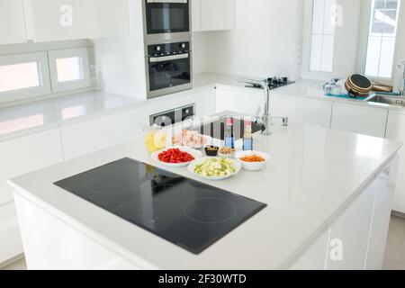 Modern kitchen in beautiful home with food ingredients Stock Photo