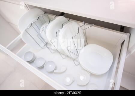 Plates in a kitchen drawer Stock Photo